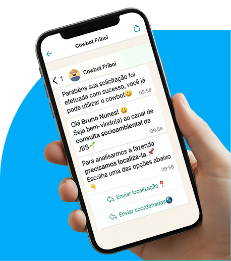 Hand holding smartphone with Cowbot Friboi chat for farm analysis.